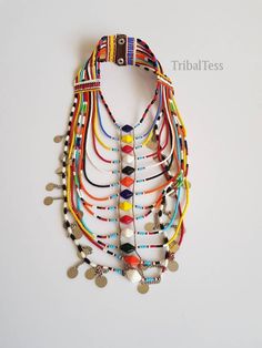 This necklace is 100% handcrafted using colorful fine beads. Perfect for weddings, traditional events, African themed events ect. The necklace has 13 strands all joined together. It has a leather closure with 2 buttons. Buy multiple items and pay shipping for ONE item only. **This necklace ships via DHL Express.(They take 3 to 5 days). More neckleces here; https://www.etsy.com/shop/TribalTess?ref=seller-platform-mcnav&section_id=21306083 Back to my shop; https://www.etsy.com/shop/TribalTess? Necklace With Colorful Round Beads For Traditional Ceremonies, Beaded Necklaces For Traditional Ceremonies And Festivals, Multicolor Beaded Necklaces For Traditional Ceremonies, White Beaded Choker For Festivals, Handmade Multicolor Bridal Necklace With Round Beads, Bohemian Multicolor Beaded Necklaces For Traditional Ceremonies, Traditional Beaded Necklaces With Colorful Beads For Festival, Multicolor Round Beads Jewelry For Traditional Ceremonies, Bohemian Multicolor Beaded Necklace For Wedding