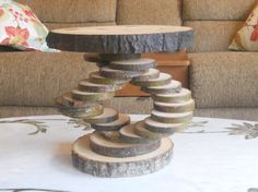 a table that has some kind of wooden object on it's base and is made out of logs