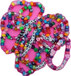 Rave Style Colorful Beaded Bracelets For Festival, Rave Style Festival Beaded Bracelets With Colorful Beads, Fun Beaded Bracelets For Festival, Fun Beaded Bracelets For Party Favors, Fun Multicolor Wristband With Letter Beads, Rave Style Multicolor Friendship Bracelets, Playful Pink Friendship Bracelets For Party, Rave Style Multicolor Beaded Friendship Bracelets, Playful Pink Friendship Bracelets For Parties