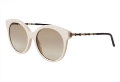 The glasses ship insured Priority Mail and may require a signature for delivery. These guaranteed authentic, NWT GUCCI Ivory Round Cat Eye Sunglasses, style #GG0653S, color code 004, have a 55mm lens width, 18mm bridge width, and a 145mm temple length. The sunglasses have an ivory round cat eye front frame with Dark Gold metal and tan bamboo arms accented with tortoise ear pieces. The lenses are light brown gradient, UV protection with a Category 1 Filter.   The sunglasses have the iconic interl Elegant White Sunglasses For Formal Occasions, White Cat Eye Sunglasses For Formal Occasions, Formal White Sunglasses With Gradient Lenses, Formal White Cat Eye Sunglasses, White Round Frame Sunglasses With Gradient Lenses, Elegant Cream Sunglasses With Tinted Lenses, Classic White Round Frame Sunglasses, Luxury Cream Sunglasses With Gradient Lenses, Gucci White Sunglasses With Uv Protection