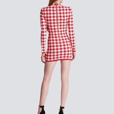 The Abby Long Sleeve Gingham Print Button Embellished Mini Dress is a charming and stylish ensemble that exudes retro-inspired flair with a modern twist. Featuring a classic gingham print adorned with button embellishments, this mini dress offers a playful yet sophisticated look suitable for various occasions. 1. Gingham Print: The gingham print adds a touch of vintage charm and timeless appeal to the dress. This classic pattern is versatile and never goes out of style, making it perfect for both casual and semi-formal settings. 2. Button Embellishments: The button embellishments along the front of the dress add visual interest and a hint of retro flair. These decorative buttons serve as both functional and decorative elements, enhancing the overall design of the dress. 3. Long Sleeve Desi Embellished Mini Dress, Button Embellishments, Loose Maxi Dress, Linen Shirt Dress, Shirt Dress Casual, Cami Crop Top, Decorative Elements, Decorative Buttons, Gingham Print