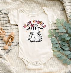 "Stay Spooky Toddler Shirt, Halloween Baby Onesie®, Retro Ghost Shirt, Retro Halloween Shirt, Spooky Baby Onesie®, Stay Spooky Youth Shirt, Toddler Shirt, Funny Halloween Baby Clothes, Funny Halloween Bodysuit, Kids Shirt, Cute Halloween Clothes, Halloween Gift for Kids, Halloween Youth Shirt, Halloween Toddler Shirt, My First Halloween Welcome to SareKidsStyle! HOW TO ORDER * Please review all the information provided before placing an order. 1. Select the style and size using the drop-down men Halloween Cotton Onesie For Playtime, Halloween Playtime Cotton Onesie, Cute Cotton Halloween Onesie, White Halloween Onesie In Casual Style, Casual White Onesie For Halloween, White Casual Onesie For Halloween, White Casual Halloween Onesie, Cute White Halloween Onesie, Halloween Onsies