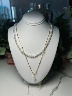 Stunning layered pearl and gold chain necklace with pearl dangle. Multi-strand Layered Pearl Chain Necklace For Parties, Multi-strand Layered Pearl Necklace For Party, Party Layered Pearl Necklace With Pearl Chain, Gold Double Strand Pearl Necklaces, Multi-strand Pearl Drop Necklaces For Party, Gold Pearl Beaded Chain Layered Necklace, Gold Pearl Layered Necklace With Beaded Chain, Gold Double Strand Pearl Necklace, Gold Pearl Multi-strand Layered Necklace