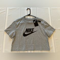 Nike Tshirt Xs Brand New With Tags Crop Style Smoke / Pet Free Home Nike Athleisure T-shirt For Spring, Nike Spring Athleisure T-shirt, Nike Athleisure Tops With Letter Print, Nike Gray Tops With Letter Print, Trendy Nike T-shirt For Spring, Basic Nike Crew Neck Top, Trendy Nike T-shirt With Letter Print, Trendy Nike Spring T-shirt, Nike Trendy Top For Spring