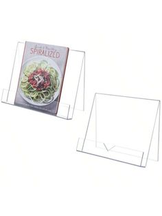 two clear acrylic signs with the words spiralized on one side and an image of a bowl of noodles on the other