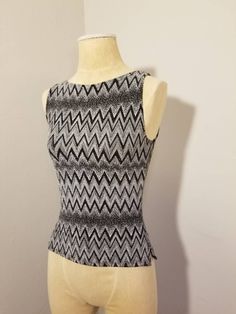 "++ IZ BYER CALIFORNIA TOP ++ Awesome metallic glitter top Zig zag design Sleeveless Small side slits on both sides Size M Made in the USA In wonderful, gently used condition ✂ - - - Measurements laid flat: Pit to pit: 14.5\" Waist: 13\" Top to bottom: 20\" Let's be friends! https://www.facebook.com/TheGirlSaidYesVintage round rack" Y2k Fitted Tank Top, Y2k Tank Top For Night Out, Fitted Y2k Tank Top, Sleeveless Party Tank Top, Y2k Sleeveless Party Tops, Y2k Sleeveless Stretch Tops, Fitted Sleeveless Top For Night Out, Casual Fitted Party Vest, Y2k Fitted Sleeveless Tops