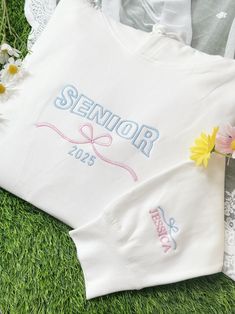 Custom Embroidered Senior Sweatshirt | Coquette Bow Sweatshirt | Customized Graduation Gift for Class of 2025 | Unique Crewneck Sweater 🎈Celebrate your graduate with our Custom Embroidered Senior Sweatshirt featuring a charming Coquette Bow design! Perfect for the Class of 2025, this cozy crewneck sweatshirt is a thoughtful and unique graduation gift. Personalize it to make it truly special--ideal for capturing unforgettable memories as they step into their future! 🎈Upgrade to Thick Fabric is White Long Sleeve Sweatshirt With Letter Embroidery, White Crew Neck Hoodie With Letter Embroidery, White Hoodie With Custom Embroidery, White Sweatshirt With Custom Embroidery For Spring, White Long Sleeve Hoodie With Custom Embroidery, White Custom Embroidered Sweatshirt For Spring, Spring White Sweatshirt With Custom Embroidery, White Long Sleeve Hoodie With Embroidered Graphics, Spring Embroidered White Hoodie