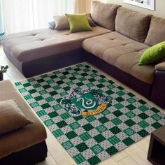 a living room with a couch, coffee table and rugs on the floor in front of it