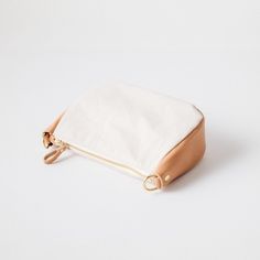 The Natural Canvas Medium Crossbody Bag is a canvas and leather bag handmade in the KMM & Co. studio in Atlanta. Each one is meticulously crafted from heavyweight canvas, full-grain leather, a solid brass zipper, and solid brass D-rings to attach a crossbody strap. (Choose from one made in the same leather as the gusset of the bag — a vintage-inspired chain link strap, a super-adjustable slider strap, or a squishy two-ply strap — or go with a classic crossbody strap in Russet or in your choice o Everyday Canvas Pouch With Zipper Closure, Everyday Leather Canvas Bag With Zipper Pocket, Leather Canvas Bag With Zipper Pocket For Everyday, Leather Pouch Canvas Bag For Everyday Use, Canvas Pouch Bag With Leather Handles, Everyday Canvas Bag With Zipper Pouch, Leather Canvas Pouch Bag With Removable Pouch, Beige Leather Shoulder Bag With Zipper Pouch, Everyday Beige Leather Pouch