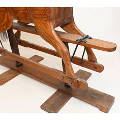 an old wooden rocking horse is being displayed