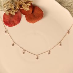 Pear Dangles  Rose Gold Charm Necklace| Eyedrop Charms Stone Details → Shape:ROUND → Size: 1.10 ↣ Weight: 0.007 → Shape:ROUND → Size: 1.30MM ↣ Weight: 0.01 → Make: High Quality  ↣ Type: Moissanite ↣ Color: Colorless Handmade item Gemstone: DIAMOND Jewelry style: Art deco Necklace length: Adjustable length Can be personalized Made to Order These Beautiful Romantic DIAMOND  BRIDAL NECKLACE are made of very fine quality of Mossonite Diamonds for your special day! Very romantic crystal bridal jewelry set: necklace, bracelet and earrings. Gorgeous bridal or bridesmaids jewelry set for your wedding day! This wedding jewelry set is available in silver, gold or pink gold(rose gold) color to match your dress Making Process: Handmade - Crafted by our experienced team The material used in these Neckl Dainty Rose Gold Drop Necklace With Clavicle Chain, Dainty Rose Gold Teardrop Pendant Drop Necklace, Rose Gold Dangle Charm Necklaces, Dainty Rose Gold Drop Necklace, Crystal Bridal Jewelry Sets, Bridesmaids Jewelry, Rose Gold Charms, Necklace Elegant, Bridesmaid Jewelry Sets