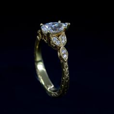 a gold ring with diamonds on it