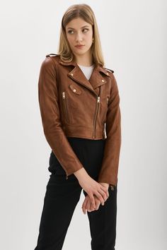 A high-end classic smartly suited for warmer days, the Ciara's cropped body flatters your natural shape and embodies an effortlessly casual look. Constructed with premium vegetable-tanned leather, this key top piece only gets better with time. Cropped Biker Jacket, Luggage Sizes, Leather Biker Jacket, Natural Shapes, Gold Leather, Crop Jacket, Vegetable Tanned Leather, Biker Jacket, Designer Collection