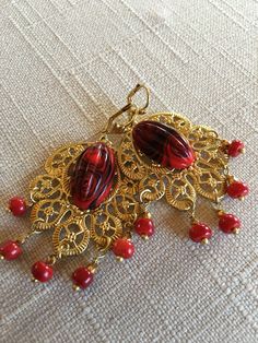 Vintage Oriental Baroque Brass Earrings With Genuine Coral Beads. Vintage Red /Black Glass. Vintage Brass Leverback Closure.  Size : 2 3/4 inches.                  (7cm) Ornate Red Earrings For Party, Elegant Red Beaded Earrings, Elegant Red Handmade Clip-on Earrings, Elegant Red Chandelier Earrings With Dangling Beads, Baroque Chandelier, Baroque Earrings, Pretty Jewelry, Coral Beads, Brass Earrings