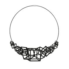 a black and white photo of a necklace made out of small pieces of metal wire