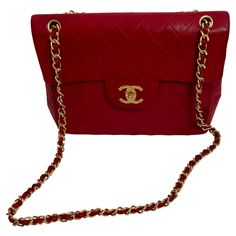 This is a large quilted lambskin bag which can be worn crossbody or shoulder. Vintage from the 80s it has a rare diamond etched CC turn lock fastening; interwoven leather and gold tone metal strap; a rear patch pocket; burgundy leather lining with two slot pockets, and one zipped pocket with a CC pull. This bag was made in France and is in good vintage condition. There are some minor scuffs and discoloration as shown in the pictures. It has many years of wear in it and is a classic Chanel model. Chanel Crossbody Bag, Rare Diamond, Chanel Crossbody, Classic Chanel, Hologram Stickers, Chanel Model, Metal Straps, Red Vintage, The 80s