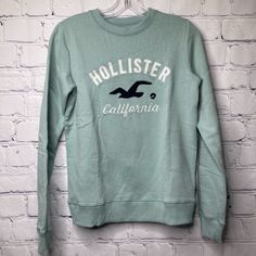 Hollister Sweatshirt. New Without Tags, Never Worn. #Ja15m Casual Cropped Sweater, Casual Cotton Sweater With Logo Print, Green Casual Sweatshirt With Logo Print, Green Logo Print Casual Sweatshirt, Casual Crew Neck Top With Logo Print, Casual Long Sleeve Tops With Logo Print, Casual Cotton Sweatshirt With Logo Print, Casual Long Sleeve Sweater With Logo Print, Casual Winter T-shirt