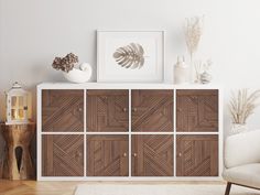 a white chair sitting next to a wooden cabinet