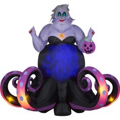 an inflatable costumed character sitting on top of a blue and purple octopus