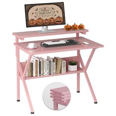 a pink computer desk with books and pumpkins on the top shelf next to it