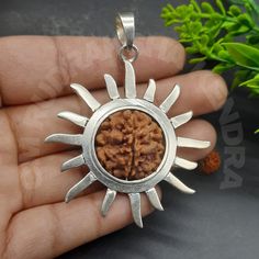 1 Mukhi / One Face Rudraksha From Nepal - Lab Certified  Size - 20 mm (approx) Origin:- Nepal Ruling Planet:- SUN Ruling God:- LORD SHIVA The 1 Mukhi Rudraksha, also known as the Ek Mukhi Rudraksha, is one of the rarest and most powerful beads. It is believed to have immense spiritual and healing benefits. Some of the benefits of wearing the 1 Mukhi Rudraksha are: Spiritual growth: The 1 Mukhi Rudraksha is believed to enhance spiritual growth and aid in meditation. It is believed to help the wearer attain spiritual enlightenment and connect with the divine. Healing: The 1 mukhi Rudraksha is believed to have healing properties and can help with ailments related to the eyes, ears, head, and skin. Self-confidence: This Rudraksha is believed to enhance self-confidence, reduce fear, and increas Sterling Silver Temple Jewelry For Meditation, Spiritual Sun And Moon Design Jewelry, Rudraksha Jewelry, Planet Sun, Rose Mehndi Designs, Divine Healing, Silver Lab, Spiritual Tools, Spiritual Wellness