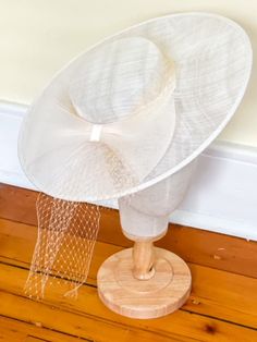 Ivory Fascinator Style Hat with Champagne horsehair bow and champagne blusher veil tie. Sits on head with a silver hair comb. Bow Fascinator, Ivory Fascinator, Silver Hair Comb, Blusher Veil, Fascinator Hat, Fascinator Hats, Horse Hair, Silver Hair, Hair Comb