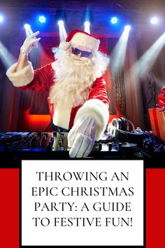 a dj dressed as santa claus with his hands in the air and lights on behind him