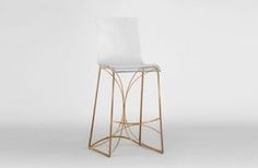 a gold and white bar stool with a clear seat on the backrest, in front of a plain background