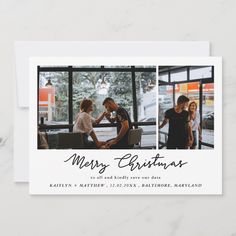 merry christmas card from zazzle featuring two people sitting at a table in front of a window