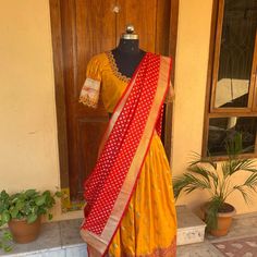 Wedding lehenga choli/ lehenga set with dupatta / teens lehenga/ bridal lehenga/ kids lehenga Indian banarasi half saree / crop top lehenga/ lehenga USA / Langa voni / voggish / yellow red lehenga / pattu pavadai Here is a beautiful and traditional Indian banarasi katan silk lehenga in mustard yellow color with red color border combination is a stunning piece for your upcoming parties!! It's a 3 piece set that includes skirt , hand embroidered blouse and red banarasi dupatta, please find the det Traditional Drape Chanderi Lehenga For Festive Occasions, Festive Traditional Drape Chanderi Lehenga, Art Silk Lehenga With Cutdana In Traditional Drape, Anarkali Banarasi Silk Choli With Traditional Drape, Anarkali Choli In Banarasi Silk With Traditional Drape, Traditional Drape Art Silk Lehenga With Cutdana, Traditional Drape Banarasi Silk Choli For Navratri, Festive Dola Silk Choli With Self Design, Banarasi Silk Choli With Dupatta In Traditional Drape