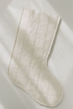 an oven mitt sitting on top of a white table