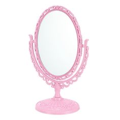 a pink vanity mirror sitting on top of a table