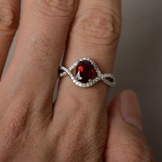 This is a gorgeous handmade creation. Its beauty is its simplicity & Elegance. The 6*8mm oval cut natural garnet crafted in sterling silver with rhodium plated. All item is sent in a beautiful gift box You can realize more lovely stuff clicking the link https://www.etsy.com/shop/knightjewelry?refshopsection_shophome_leftnav Please leave the correct address and you phone number for delivering successfully. Garnet Gemstone Jewelry For Proposal, Sterling Silver Ruby Ring For Proposal, Oval Garnet Jewelry With Halo Setting, Silver Garnet Ring For Valentine's Day, Oval Garnet Ring With Halo Setting, Polished Lab-created Ruby Ring, Oval Garnet Birthstone Ring As Gift, Oval Garnet Birthstone Ring For Anniversary, Oval Garnet Birthstone Ring