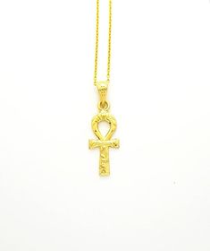 Ankh of Ra Gold Necklace, 14k Gold Vermeil Over Sterling Silver, Ancient Egyptian Ankh Jewelry.The Egyptian ankh necklace carries a powerful message, literally meaning “the breath of life”. This Egyptian revival pendant is considered a key to life, as it offers you a powerful union. Bringing together feminine and masculine aspects that are contained in their form. Creating a never-ending circuit of energy, that helps ensure a boost in energy on a day to day basis.• Material: Our Ankh necklace is Gold Ankh Amulet Necklace, Spiritual Ankh Necklace In Yellow Gold, Spiritual 14k Gold Ankh Jewelry, 14k Gold Ankh Spiritual Jewelry, Gold Cross Amulet Necklace, Traditional Hallmarked Ankh Necklace, Yellow Gold Hallmarked Necklace For Blessing, Hallmarked Yellow Gold Necklace For Blessing, Spiritual Ankh Necklace Hallmarked