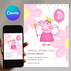 a person holding up a phone next to a pink card with a princess pig on it