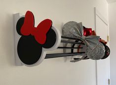 the mickey mouse head is hanging on the wall