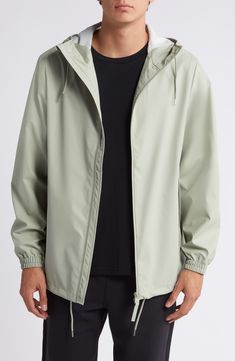 This lightweight, waterproof jacket with a longline silhouette keeps minimalism at the forefront as it keeps you dry. A hood with a built-in cap, an adjustable hemline and underarm eyelets bring comfort and breathability to the design that closes with a two-way, waterproof zipper. 30" length (size Medium) Hidden two-way front-zip closure Drawstring hood Long sleeves with elastic cuffs Unlined 100% polyester Machine wash, dry flat Imported Green Waterproof Windbreaker For Spring, Solid Raincoat With Adjustable Hood For Spring, Sporty Hooded Raincoat, Spring Waterproof Green Windbreaker, Spring Green Waterproof Windbreaker, Spring Raincoat With Adjustable Hood, Spring Solid Color Raincoat With Adjustable Hood, Rainy Season Windbreaker With Detachable Hood, Spring Waterproof Parka For Streetwear