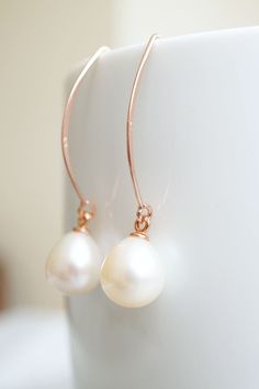 Long Rose Gold Freshwater Pearl Drop Earrings, No. RGHE024 :*About This Piece*: ♦︎ High quality, lustrous cream freshwater pearl drops are hung on long rose gold vermeil earrings. These earrings are elegant and classy with a timeless appeal. ♦︎ Length - 1.7 in (42 mm) ♦︎ Width - .47 in (12 mm) by .4 in (10mm) ♦︎ All items from my shop are packaged in padded cardboard jewelry boxes. Custom gifting options available upon request. ♦︎ Visit my shop for more here: https://www.etsy.com/shop/storygirlc Classic Rose Gold Pearl Drop Earrings, Rose Gold Teardrop Pearl Earrings For Anniversary, Rose Gold Teardrop Pearl Earrings With Ear Wire, Rose Gold Drop Pearl Earrings Gift, Rose Gold Pearl Earrings With Ear Wire For Anniversary, Minimalist Rose Gold Teardrop Pearl Earrings, Elegant Rose Gold Pear-shaped Pearl Earrings, Delicate Rose Gold Pearl Drop Earrings, Rose Gold Pear-shaped Pearl Drop Jewelry