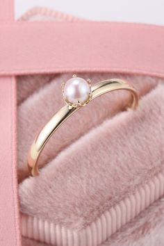 This stunning pearl ring is perfect to wear at any occassion. Made in pure gold. #morganitering #diamondring #gemstonering #engagementring #vintagering Classic Pearl Promise Ring, Elegant 14k Gold Solitaire Flower Ring, Elegant Yellow Gold Solitaire Flower Ring, Elegant Solitaire Flower Ring In 14k Gold, Exquisite Pearl Ring For Anniversary, Fine Jewelry Pearl Solitaire Ring With Round Band, Solitaire Pearl Ring, Fine Jewelry, Elegant Gold Solitaire Couple Rings, Solitaire Pearl Ring With Round Band