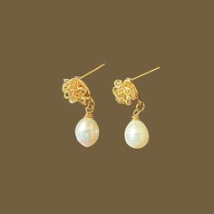 Discover the charm of our Freshwater Pearl Drop Earrings, exquisitely handmade for brides and bridesmaids. Crafted with elegance in mind, each gold earring features a delicate freshwater pearl, making them a perfect gift for weddings or everyday sophistication. Celebrate your style with authentic, timeless beauty. Pearl Drop Earrings Bridal, Freshwater Pearl Drop Earrings, Jewelry Elegant, Gold Earring, Handmade Gold, Brides And Bridesmaids, Bridesmaid Jewelry, Pearl Drop Earrings, Pearl Drop