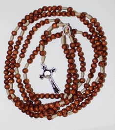 "20 Decade Brown Wood Beads Rosary on Strong Cord Holy Rosary of Sacred Mysteries 46.45, catholic rosary, rosary beads, handmade rosary, 20 Decade Brown Wood Beads Rosary on Strong Cord Holy Rosary of Sacred Mysteries This is a full rosary which includes all 20 decades. Its made of a blue wood beads. The beads are strung on a strong cord for durability. The center is made of metal medal. The centerpiece is double sided. On one side there is Miraculous Jesus and on the other Virgin Mary. The rosa Brown Beaded Cross Rosary, Brown Cross Rosary In Spiritual Style, Brown Beaded Spiritual Rosary, Brown Beaded Cross-shaped Rosary, Brown Cross-shaped Spiritual Rosary, Brown Cross Shaped Spiritual Rosary, Brown Spiritual Rosary With Cross, Brown Beaded Rosary With Cross Shape, Brown Wooden Beaded Cross Rosary