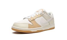 The Nike Dunk Low “If Lost Return To” is a colorway of the retro basketball shoe with a patchwork-like arrangement of textile overlays.  A versatile colorway with neutral tones, the “If Lost Return To” Dunk Low features a white textile base with a beige leather toe cap, tan leather on the forefoot and eyelets, and beige leather on the heel overlay.  A Sail leather Swoosh logo appears on both sides of the shoe.  On the back, an orange “Nike” logo matches the stitching found on the heel.  An “If L White Textile, Dunk Low Nike, Retro Basketball Shoes, Retro Basketball, Sb Dunk Low, Sb Dunk, Swoosh Logo, Stadium Goods, Nike Dunk Low