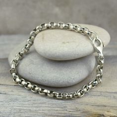 Classic, simple, and always a perfect look for men or women!The Box Bracelet comes to you in handcrafted sterling silver in 7.5 inches.  If a longer length is required, you can select 8.0 or 8.5 inches for an additional fee.Appropriate for men and women offered in a unisex style, that's a timeless look and always perfect!Metal:  .925 Sterling SilverFinish:  High PolishClosure: LobsterMSRP:  $119.99Part of the appeal of handcrafted sterling silver jewelry includes slight variations and irregulari Unique Sterling Silver Jewelry, Silver Link Bracelet, Large Bracelet, Gold Ring Stack, Christian Jewelry, Anklet Jewelry, Design Silver, Chain Earrings, Ankle Bracelets