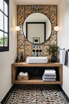 a bathroom with a sink, mirror and rug