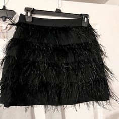 New With Tags Gb Size Xs Women’s Black Feather Mini Skirt. Worn Once For Photo Shoot For About 10 Minutes. Very Cute. Great Condition. Worn With Silver Body Suit Listing. Willing To Pair Them Together For Discount Price. Original Price $89. Asking $39. Free Shipping. Chic Evening Bottoms With Feathers, Chic Skirt With Feather Trim, Chic Feather Skirt For Night Out, Feather Trim Skirt For Night Out, Chic Feathered Bottoms For Evening, Spring Feather Skirt For Night Out, Chic Feathered Skirt For Night Out, Spring Feather Trim Skirt For Night Out, Mini Skirt With Feather Trim For Night Out