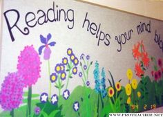 a sign that says reading helps your mind be happy with flowers and butterflies painted on it