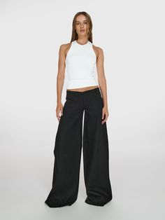 Full shot of a girl in a white viscose tank top and black wide leg jeans with low rise Black Low Rise Pants, Low Rise Black Pants, Slouchy Pants, Low Rise Pants, Slow Fashion Brands, Icon Collection, Black Trousers, Wide Legs, My Personal Style