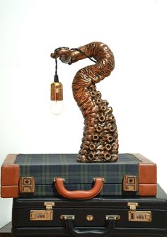 a lamp that is on top of some luggage