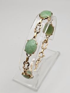 Vintage Ornate 14k Yellow Gold Jade Panel Bracelet  Item w #1438 - Clean and in good condition  - Marked 14k - 7.25 inches long with a spring ring clasp - Safety chain - Each Jade is approx 15mm Long and 12mm Wide -13.8 grams Welcome to Westgate Jewels!! We specialize in vintage estate, designer, and fine jewelry. Our shop consists of items that are estate, antique, and / or vintage conditions unless otherwise noted. This means that most items are prior owned and may have some imperfections such Green And Gold Jewelry, 12th Wedding Anniversary, Jade Charm, Bethlehem Pa, Vintage Silver Rings, Everyday Bracelet, Green Jewelry, Safety Chain, Classy Jewelry