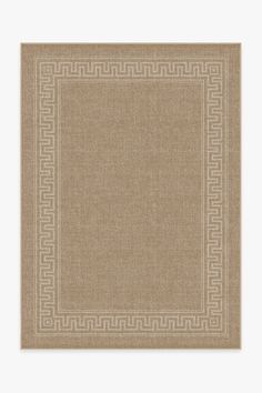 a beige area rug with an intricate greek border on the front and side of it